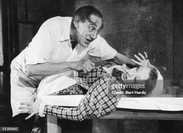 British horror actor Tod Slaughter as Sweeney Todd with a terrified Mrs Lovatt in a production of 'Sweeney Todd, The Demon Barber of Fleet Street',...