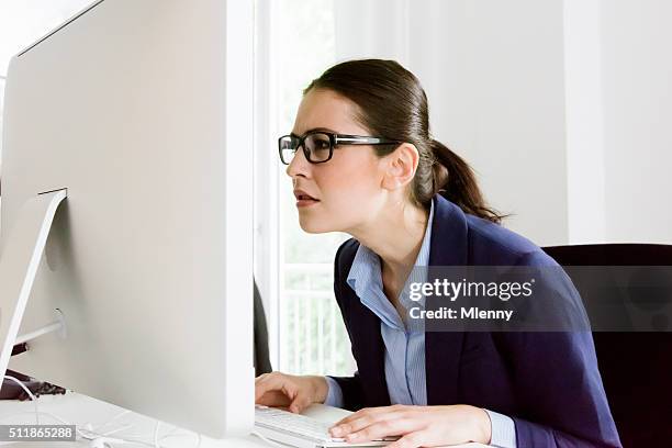 what's that? confused business woman - staring at screen stock pictures, royalty-free photos & images