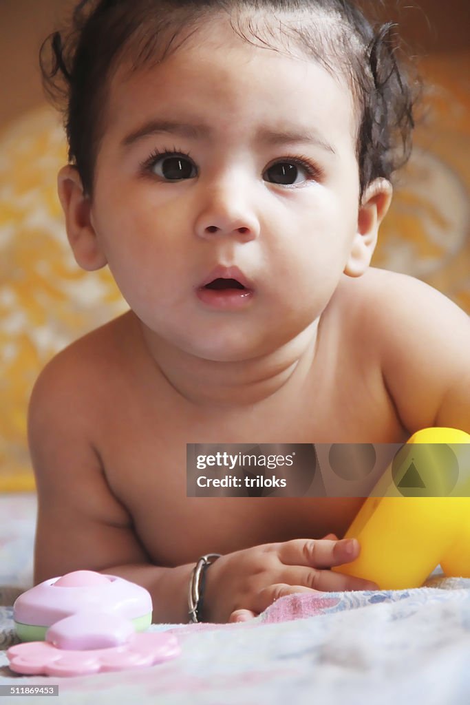 Cute baby playing with toys