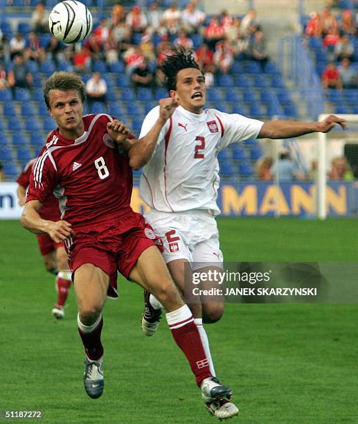 Denmark's Jasper Gronkjaer fights for ball with Poland's Dariusz Dudka during their friendly match 18 August 2004 in Poznan. AFP PHOTO JANEK...