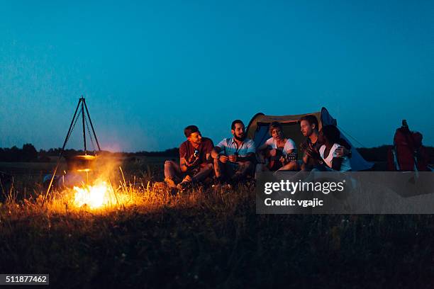 friends camping together in nature - hiking five people sunset stock pictures, royalty-free photos & images