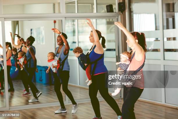 Mothers Exercising with Their Babies in a Gym