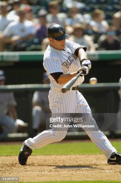 Left fielder Matt Holliday of the Colorado Rockies bats during the MLB game against the Milwaukee Brewers at Coors Field on July 1, 2004 in Denver,...