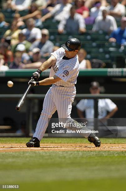Second baseman Aaron Miles of the Colorado Rockies bats during the MLB game against the Milwaukee Brewers at Coors Field on July 1, 2004 in Denver,...