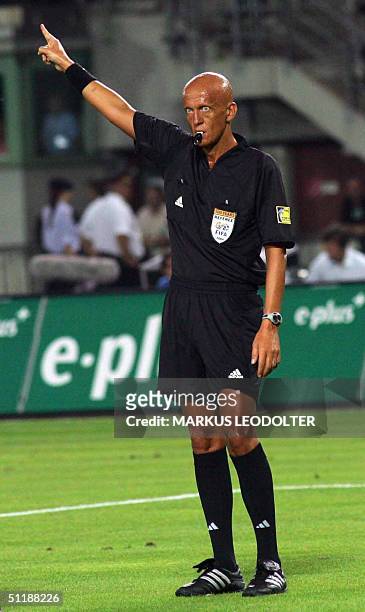 Italiam referee Pier Luigi Collina blows his whistle to signal instructions during a friendly soccer match opposing Germany vs Aiustria held in...