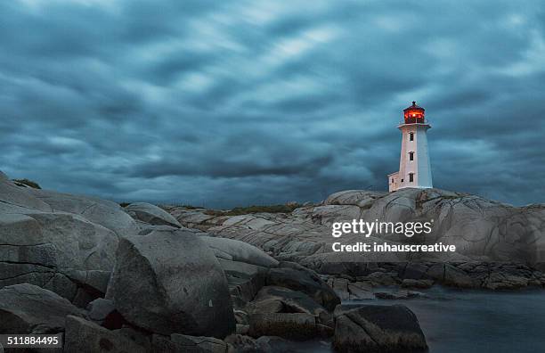 lighthouse on a stormy night - red beacon stock pictures, royalty-free photos & images