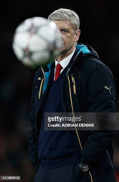 Arsenal's French manager Arsene Wenger watches his players during the UEFA Champions League round of 16 1st leg football match between Arsenal and...