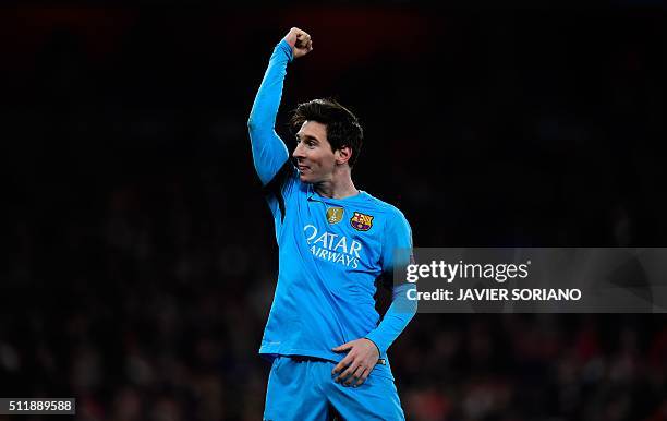 Barcelona's Argentinian forward Lionel Messi celebrates scoring his team's second goal from the penalty spot during the UEFA Champions League round...