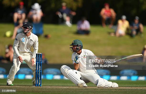 Joe Burns of Australia recovers after being hit on the helmet by a delivery from Neil Wagner of New Zealand during day five of the Test match between...