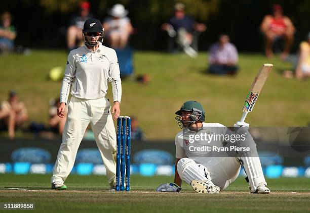 Joe Burns of Australia recovers after being hit on the helmet by a delivery from Neil Wagner of New Zealand during day five of the Test match between...