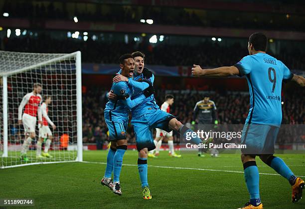 Lionel Messi of Barcelona celebrates with team mates after scoring the first goal during the UEFA Champions League round of 16 first leg match...