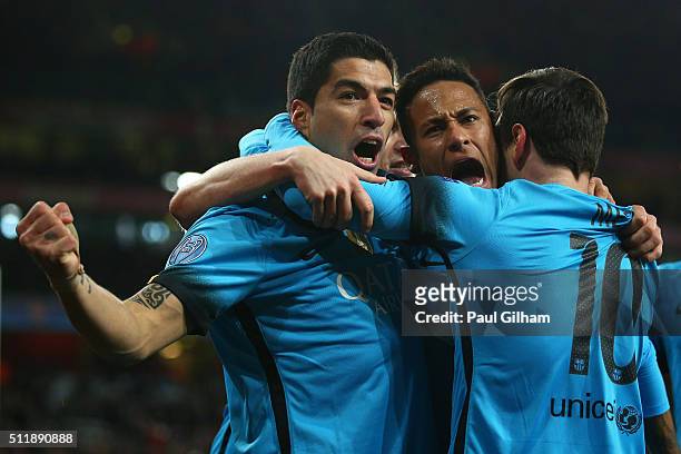 Lionel Messi of Barcelona celebrates with Luis Suarez and Neymar of Barcelona after scoring the first goal during the UEFA Champions League round of...