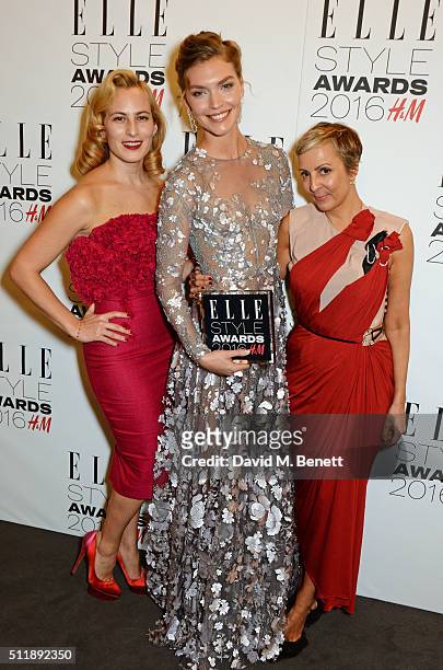 Charlotte Dellal, Arizona Muse, winner of the Fashion Director's Woman of the Year award, and Anne-Marie Curtis pose in the winners room at The Elle...