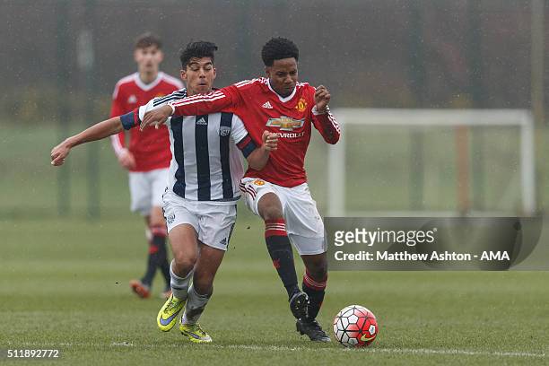 Sameron Dool of West Bromwich Albion U18 and DJ Buffonge of Manchester United U18 during the U18 Premier League match between Manchester United and...