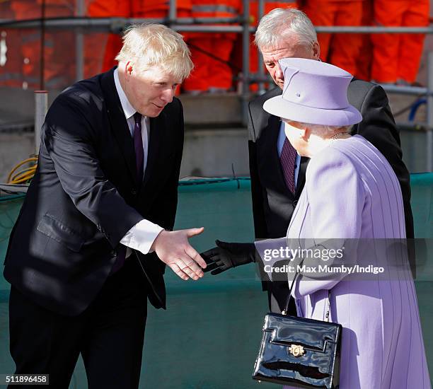 Mayor of London Boris Johnson greets Queen Elizabeth II as she arrives for a visit to the Crossrail station site at Bond Street on February 23, 2016...