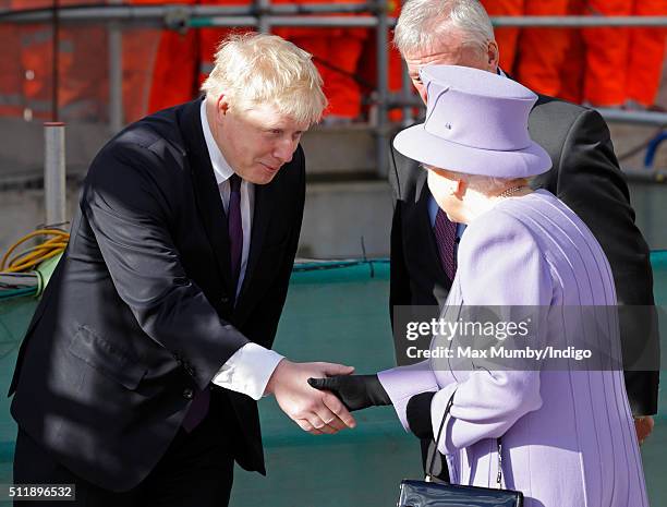 Mayor of London Boris Johnson greets Queen Elizabeth II as she arrives for a visit to the Crossrail station site at Bond Street on February 23, 2016...