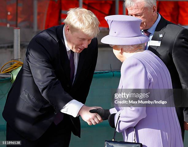 Mayor of London Boris Johnson greets Queen Elizabeth II as she arrives for a visit to the Crossrail station site at Bond Street on February 23, 2016...