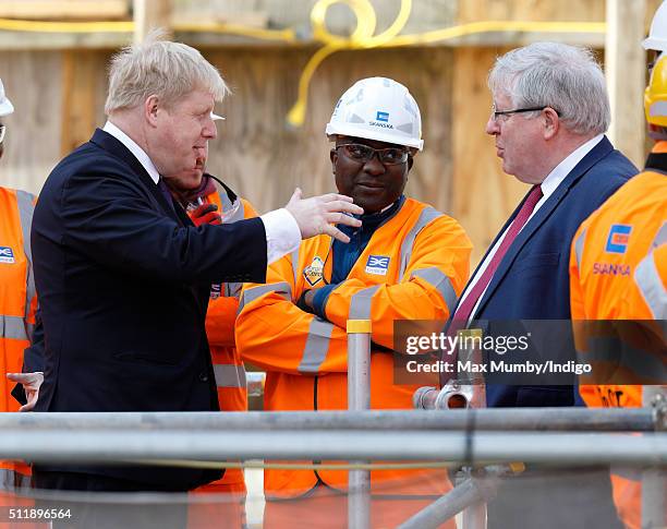 Mayor of London Boris Johnson and Transport Secretary Patrick McLoughlin meet Crossrail construction workers as they await the arrival of Queen...
