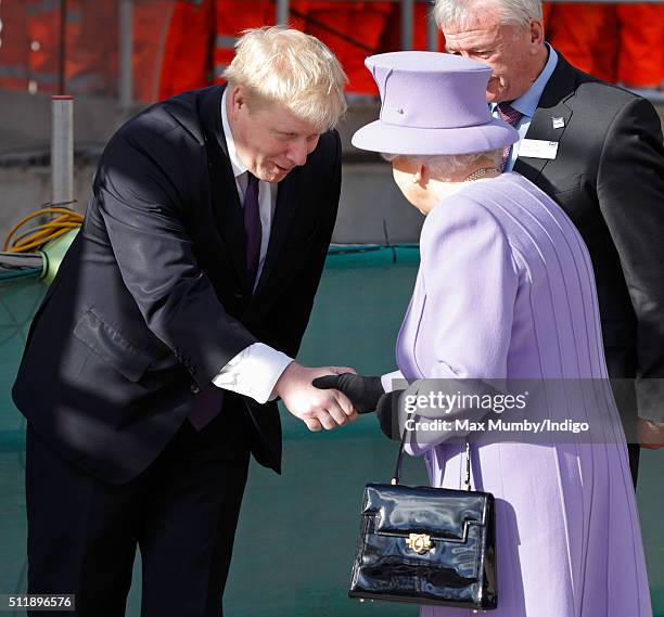 Mayor of London Boris Johnson greets Queen Elizabeth II as she arrives for a visit to the Crossrail station site at Bond Street on February 23, 2016...