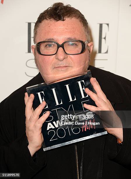 Alber Elbaz poses with his award for Outstanding Contribution To Fashion in the winners room at The Elle Style Awards 2016 at tate britain on...