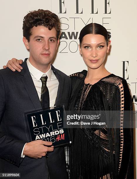Jamie xx, winner of the album of the year award, poses with presenter Bella Hadid, in the winners room at The Elle Style Awards 2016 on February 23,...