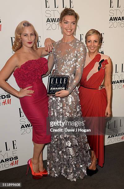 Arizona Muse poses with her award for Fashion Director's Woman of The Year with Charlotte Olympia and Anne-Marie Curtis in the winners room at The...
