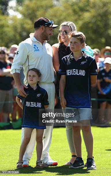 Brendon McCullum of New Zealand and his family look on during the presentation after his final test during day five of the Test match between New...