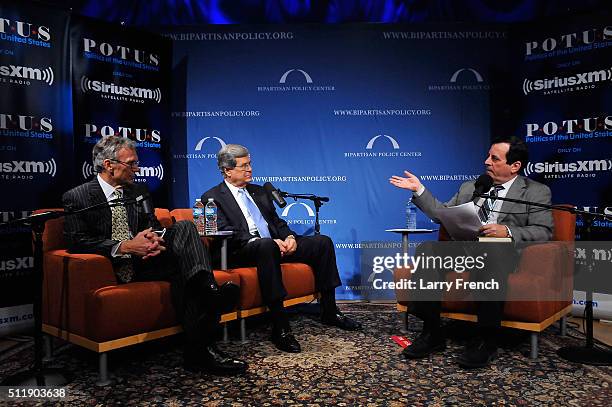 Former senators Tom Daschle, left, and Trent Lott, center, , discuss their new book, Crisis Point, at SiriusXM-Bipartisan Policy Center's event...