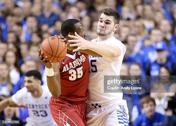 Isaac Humphries of the Kentucky Wildcats defends Donta Hall of the Alabama Crimson Tide during the game at Rupp Arena on February 23, 2016 in...