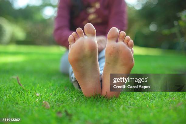 barefoot on grass - barefoot soles female stock pictures, royalty-free photos & images