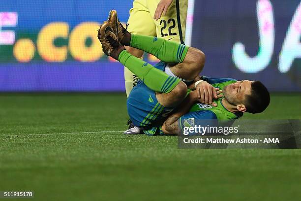 Clint Dempsey of Seattle Sounders lies on the field after a collision with Jose Guerrero of Club America during the CONCACAF Champions League match...