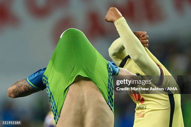 Clint Dempsey of the Seattle Sounders and Miguel Saudi of Club America swap shirts after the CONCACAF Champions League match between Seattle Sounders...