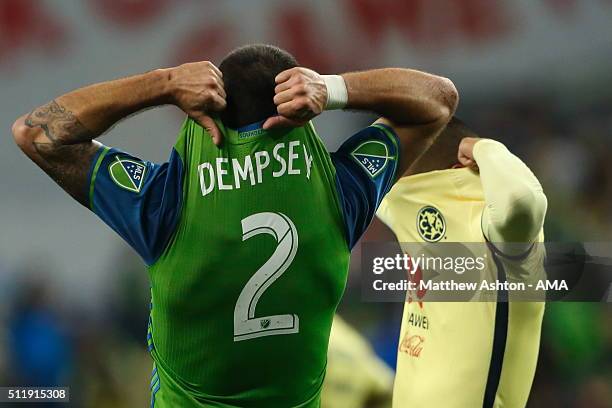 Clint Dempsey of the Seattle Sounders and Miguel Saudi of Club America swap shirts after the CONCACAF Champions League match between Seattle Sounders...