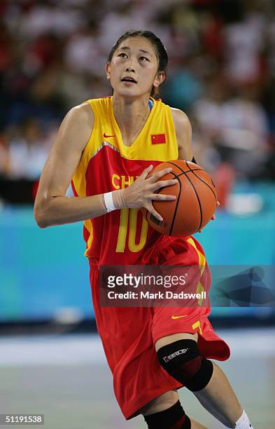 Feifei?Sui of China drives to the basket against Korea in the women's basketball preliminary game on August 14, 2004 during the Athens 2004 Summer...