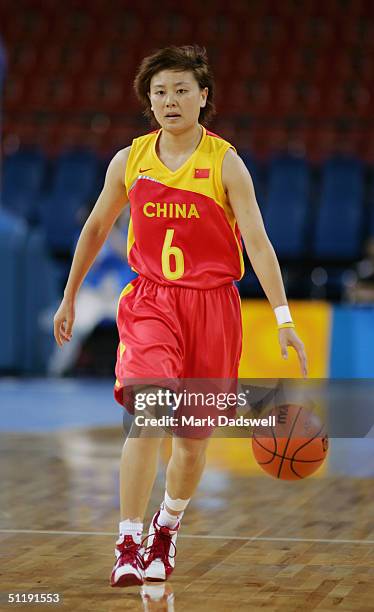 Wei Pan of China dribble the ball against Korea in the women's basketball preliminary game on August 14, 2004 during the Athens 2004 Summer Olympic...