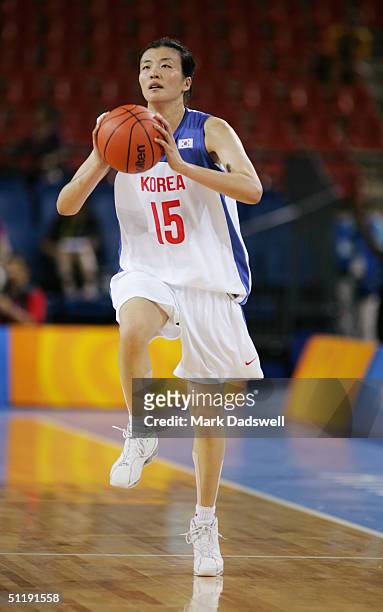 Hyun Hee Hong of Korea looks to pass against China in the women's basketball preliminary game on August 14, 2004 during the Athens 2004 Summer...