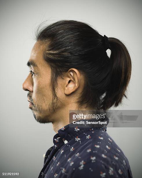portrait of a japanese man looking at camera - long hair man stock pictures, royalty-free photos & images