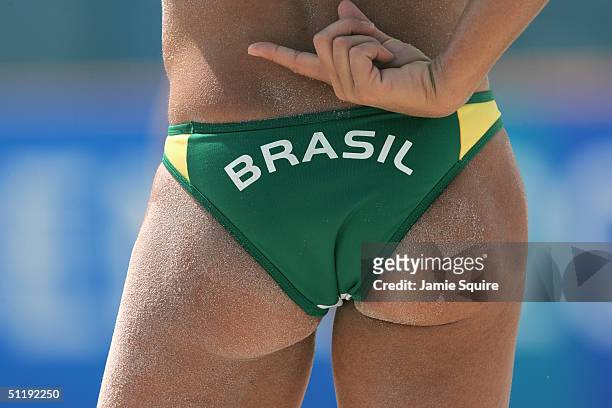 Sandra Pires of Brazil signals to partner Ana Paula Connelly in the women's preliminary match against Nila Ann Hakedal and Ingrid Torlen of Norway on...