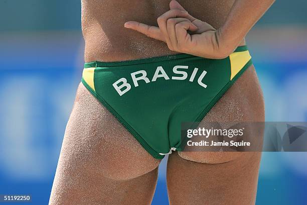 Sandra Pires of Brazil signals to partner Ana Paula Connelly in the women's preliminary match against Nila Ann Hakedal and Ingrid Torlen of Norway on...