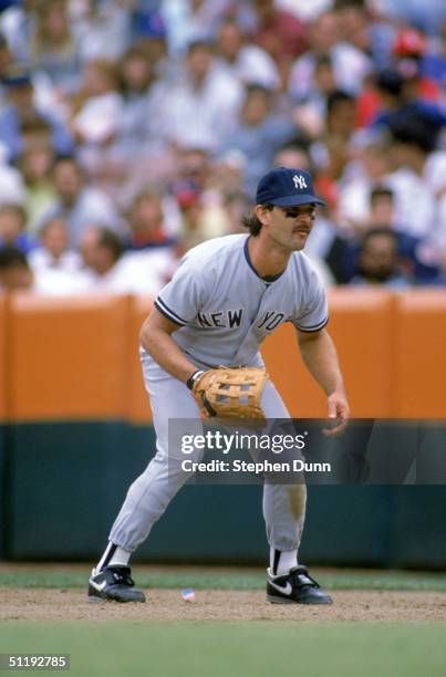 Don Mattingly of the New York Yankees focuses on home plate as he prepares for a play during a 1989 season game against the Anaheim Angels at Angels...