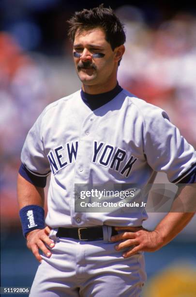 Don Mattingly of the New York Yankees looks on as he stand on the field during a game against the Oakland Athletics at Oakland-Alameda County...