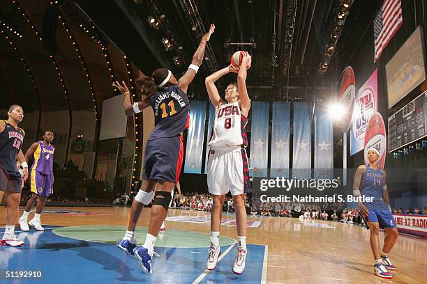Ruth Riley of the USA Basketball Women's Senior National Team shoots over Taj McWilliams-Franklin of the WNBA All-Stars during the 2004 WNBA All-Star...