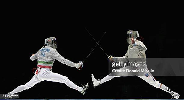 Aldo Montano of Italy fences against Julien Pillet of France en route to France's 45-42 tvictory over Italy during the men's fencing team sabre Gold...