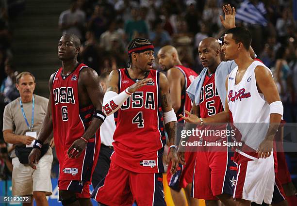 Allen Iverson of the United States congratulates Roberto Hatton of Puerto Rico after the men's basketball preliminary game on August 15, 2004 during...