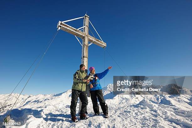 couple on the summit - sonnenkopf stock pictures, royalty-free photos & images
