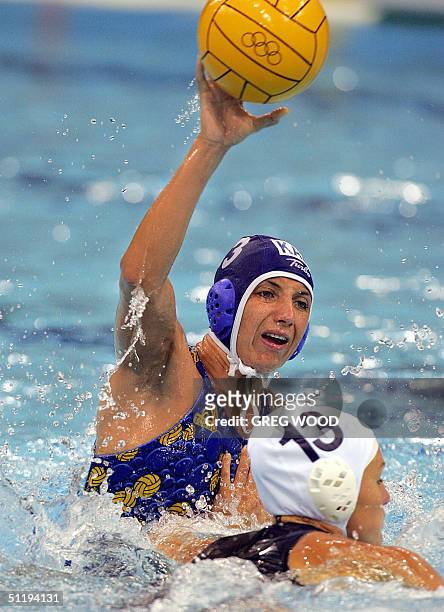 Kazakhstan's Tatyana Gubina shoots for goal during the women's preliminary group A match against Italy at the 2004 Olympic Games at the Olympic...