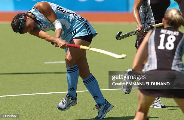 Argentinian hockey player Augustina Soledad Garcia shoots to score her team's third goal against New Zealand during their pool A match of the women's...