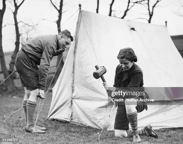 Two holidaymakers set up camp for the Easter Holidays at Glossop in Derbyshire, 10th April 1936.
