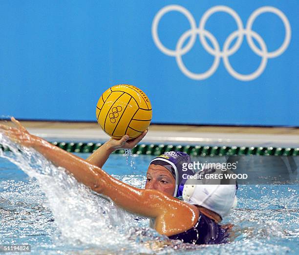 Kelly Rulon blocks Russia Natalia Shepelina as she tries to shoot the ball during the women's preliminary group B match against Russia at the 2004...