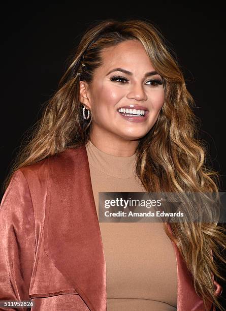 Model Chrissy Teigen poses before signing copies of her book "Cravings: Recipes For All The Food You Want To Eat" at Barnes & Noble at The Grove on...